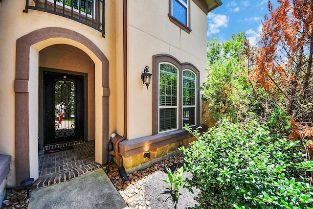 102 Stonecrop Pl, Montgomery, TX 77316 - doorway to property featuring stucco siding