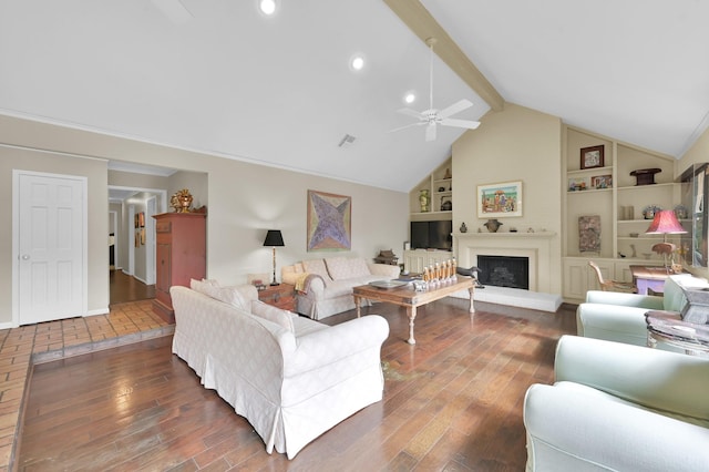 2117 Nantucket Dr, Houston, TX 77057 - living area featuring ceiling fan, wood finished floors, built in features, a fireplace with raised hearth, and recessed lighting