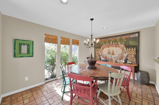2117 Nantucket Dr, Houston, TX 77057 - dining room with a chandelier, brick floors, recessed lighting, and ornamental molding