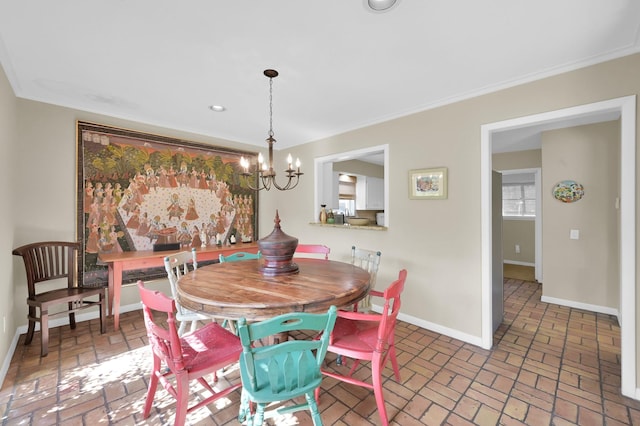 2117 Nantucket Dr, Houston, TX 77057 - dining space with brick floors, a chandelier, ornamental molding, and recessed lighting