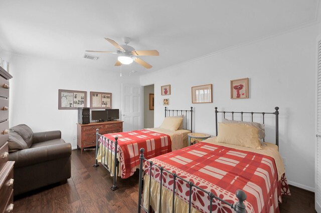 2117 Nantucket Dr, Houston, TX 77057 - bedroom featuring dark wood finished floors, a ceiling fan, and ornamental molding