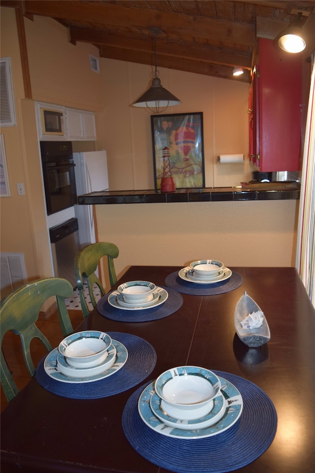 123 Sandpiper Ave, Surfside Beach, TX 77541 - dining area with beam ceiling