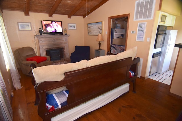 123 Sandpiper Ave, Surfside Beach, TX 77541 - living room with wood ceiling, a fireplace, and wood finished floors