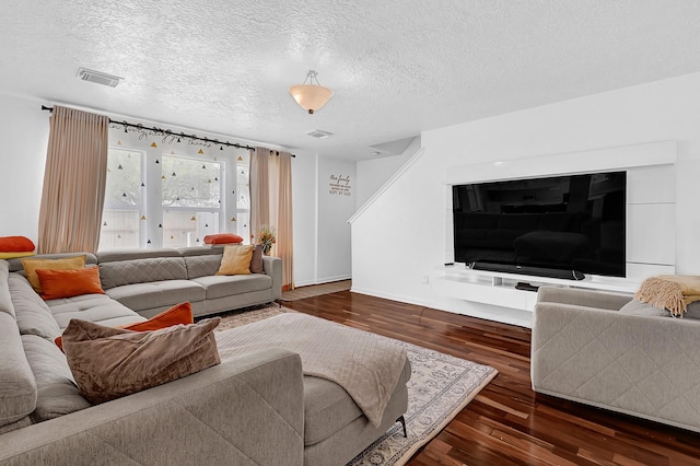 29207 Legends Hill Dr, Spring, TX 77386 - living area featuring dark wood finished floors and a textured ceiling
