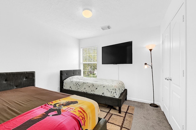 29207 Legends Hill Dr, Spring, TX 77386 - carpeted bedroom with baseboards and a textured ceiling