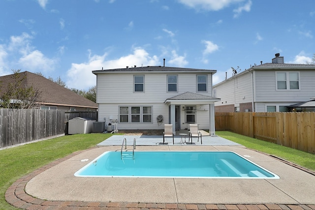 29207 Legends Hill Dr, Spring, TX 77386 - rear view of property with a storage unit, a patio area, and a fenced backyard