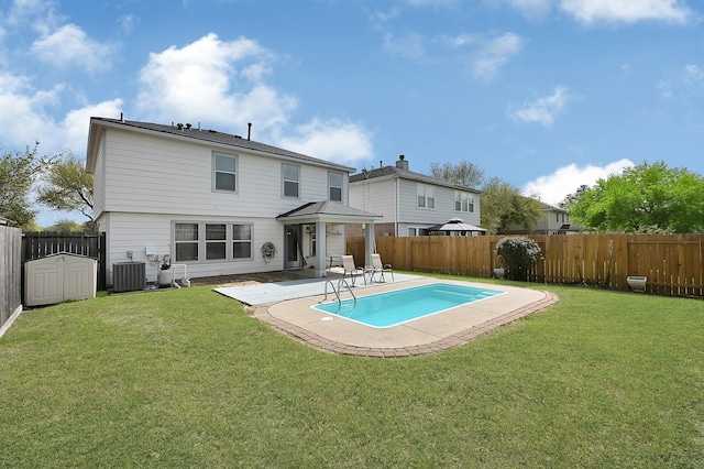 29207 Legends Hill Dr, Spring, TX 77386 - rear view of house featuring a fenced backyard, a patio, and a storage unit