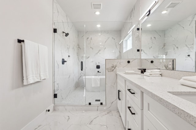 3720 Nathaniel Brown St, Houston, TX 77021 - full bath with marble finish flooring, a marble finish shower, double vanity, recessed lighting, and a freestanding bath