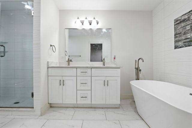 9226 Kapri Ln, Houston, TX 77025 - full bath with marble finish flooring, a shower stall, double vanity, a soaking tub, and tile walls