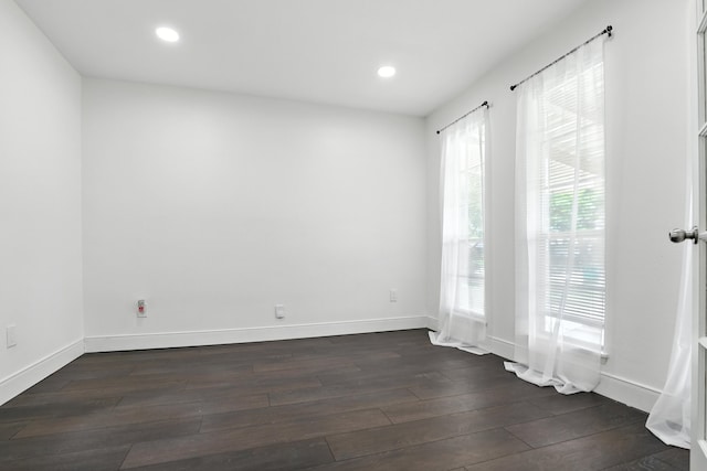 9226 Kapri Ln, Houston, TX 77025 - unfurnished room with dark wood-style flooring and recessed lighting