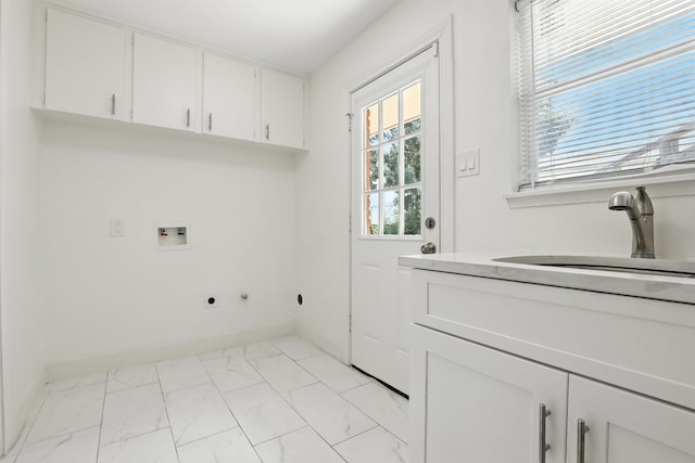 9226 Kapri Ln, Houston, TX 77025 - laundry area featuring cabinet space, light marble finish flooring, hookup for a washing machine, and electric dryer hookup
