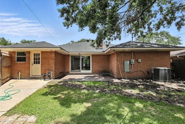 9226 Kapri Ln, Houston, TX 77025 - rear view of house with brick siding, a patio area, and a shingled roof