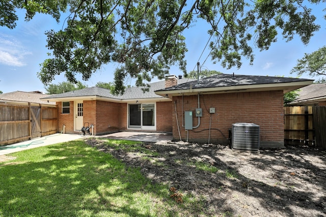 9226 Kapri Ln, Houston, TX 77025 - rear view of house with a patio area, brick siding, a fenced backyard, and a chimney