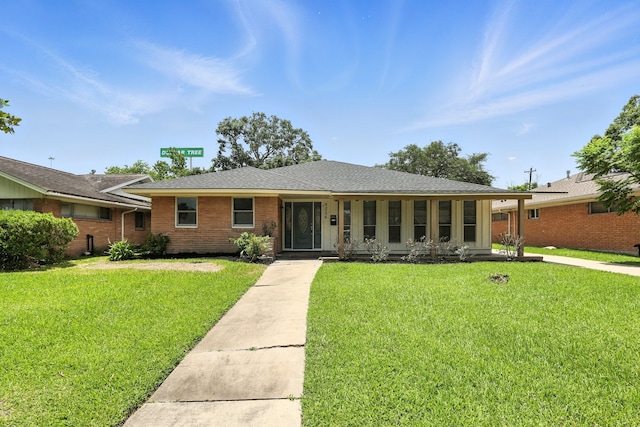 9226 Kapri Ln, Houston, TX 77025 - ranch-style home featuring a front lawn and brick siding
