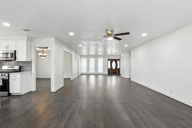 9226 Kapri Ln, Houston, TX 77025 - unfurnished living room featuring ceiling fan, recessed lighting, a chandelier, and dark wood finished floors