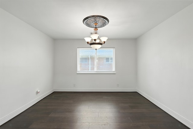 9226 Kapri Ln, Houston, TX 77025 - unfurnished room featuring a chandelier and dark wood-style flooring