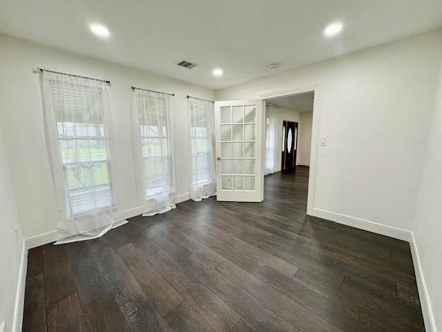 9226 Kapri Ln, Houston, TX 77025 - spare room featuring dark wood finished floors and recessed lighting