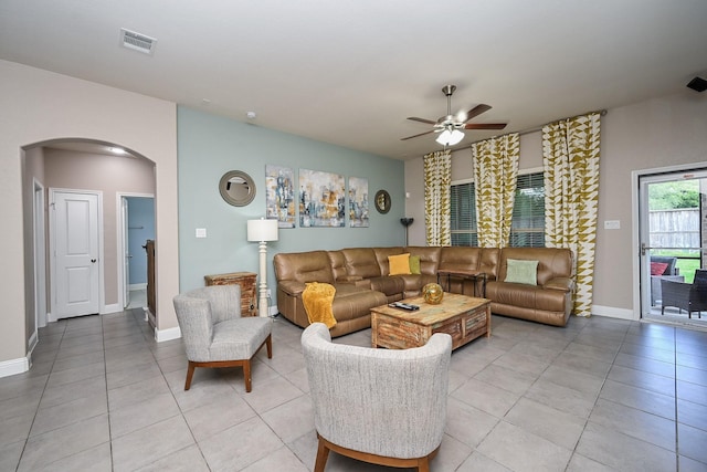 20202 Sienna Bluff Dr, Cypress, TX 77433 - living area featuring arched walkways, ceiling fan, and light tile patterned floors
