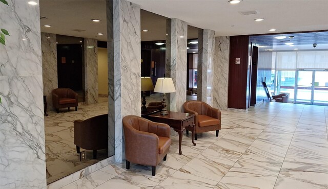 7510 Hornwood, Houston, TX 77036 - building lobby featuring a wall of windows and recessed lighting