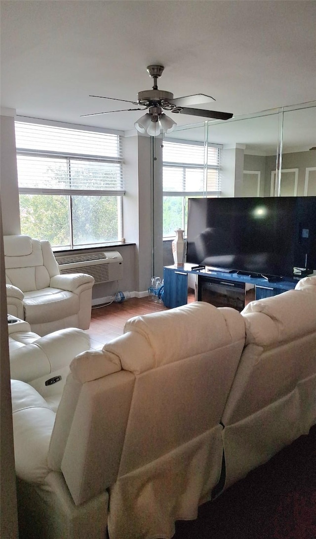 7510 Hornwood, Houston, TX 77036 - living room featuring a ceiling fan, wood finished floors, and a wall mounted air conditioner
