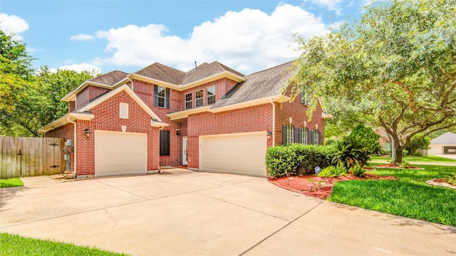22315 Claysprings Ln, Katy, TX 77450 - traditional-style home with concrete driveway, brick siding, a garage, and roof with shingles