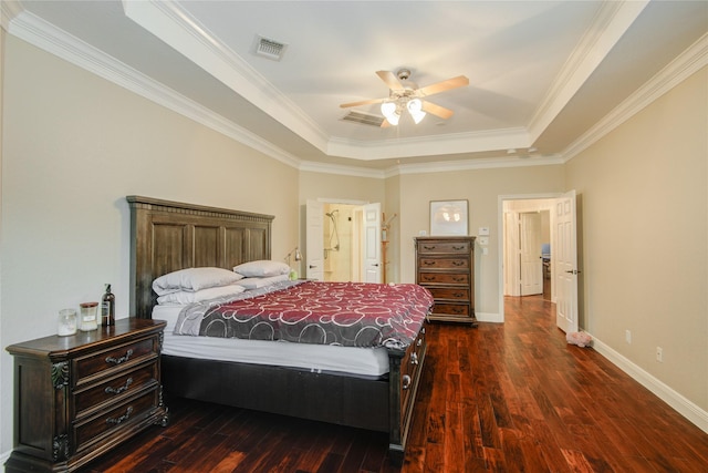 22315 Claysprings Ln, Katy, TX 77450 - bedroom featuring a tray ceiling, dark wood finished floors, crown molding, ceiling fan, and ensuite bath