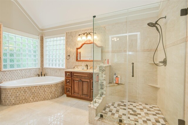22315 Claysprings Ln, Katy, TX 77450 - bathroom with vanity, lofted ceiling, a shower stall, a bath, and tile patterned flooring