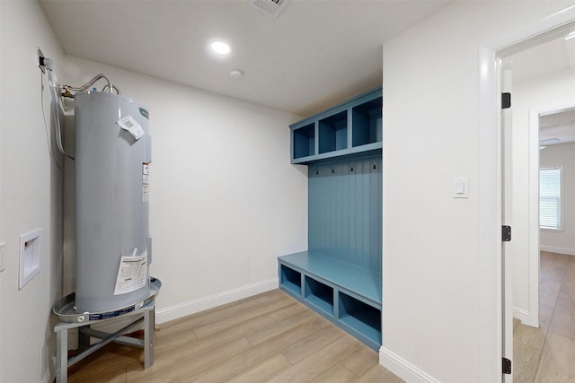 904 Dumas Dr, Bryan, TX 77803 - mudroom featuring electric water heater, light wood-style floors, and recessed lighting