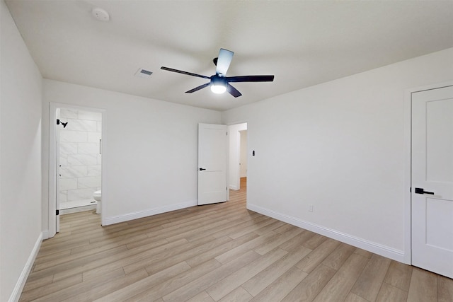 904 Dumas Dr, Bryan, TX 77803 - unfurnished bedroom with light wood-style flooring, ensuite bath, and a ceiling fan