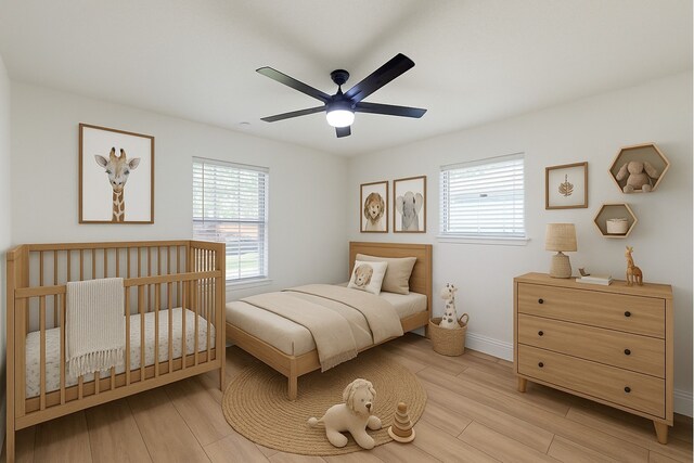 904 Dumas Dr, Bryan, TX 77803 - bedroom featuring multiple windows, light wood finished floors, and a ceiling fan