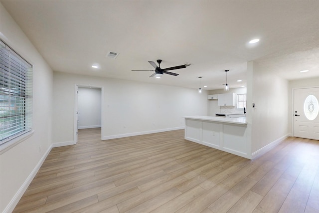904 Dumas Dr, Bryan, TX 77803 - unfurnished living room with recessed lighting, light wood finished floors, and a ceiling fan