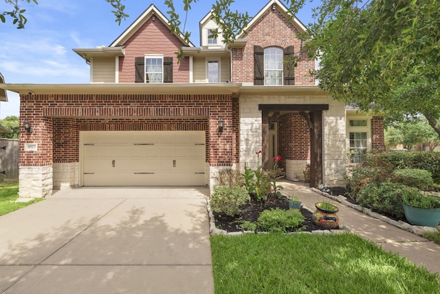 9523 Sapphire Hill Ln, Katy, TX 77494 - view of front facade with driveway, brick siding, a garage, and stone siding