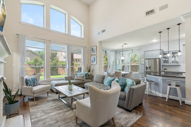 9523 Sapphire Hill Ln, Katy, TX 77494 - living room featuring dark wood-style flooring and a high ceiling