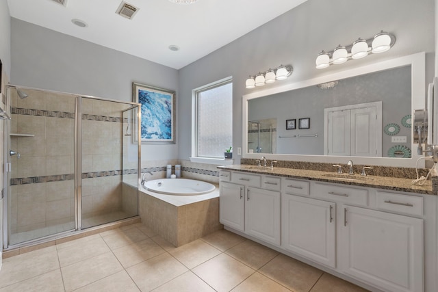 9523 Sapphire Hill Ln, Katy, TX 77494 - full bathroom with double vanity, a shower stall, a bath, and tile patterned floors