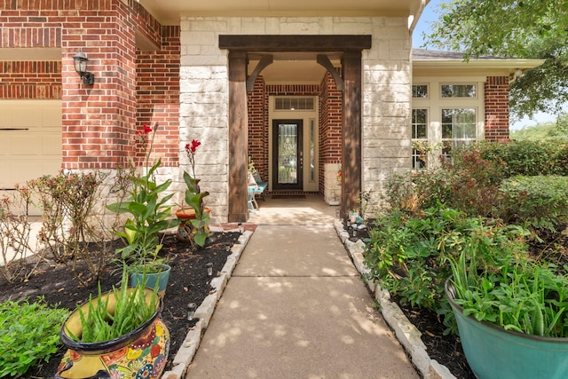 9523 Sapphire Hill Ln, Katy, TX 77494 - view of exterior entry featuring brick siding and a garage