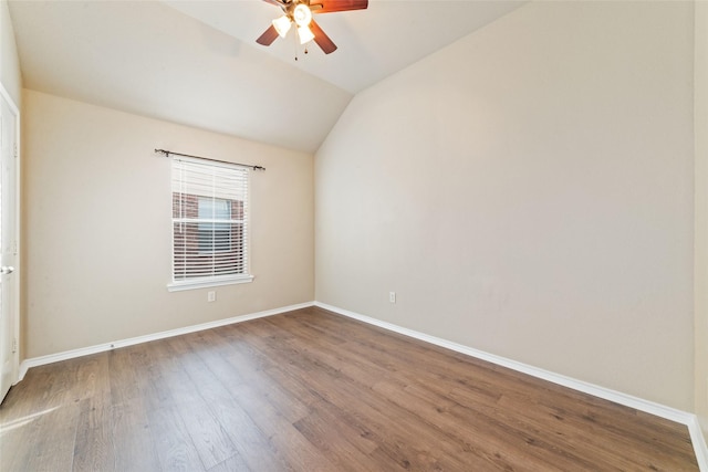 21739 W Mulberry Field Cir, Cypress, TX 77433 - spare room with a ceiling fan, wood finished floors, and lofted ceiling