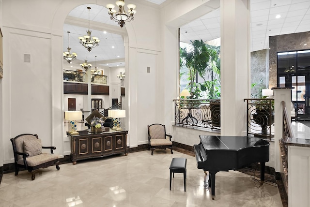 3525 Sage Rd Unit 813, Houston, TX 77056 - living area featuring a chandelier, arched walkways, a towering ceiling, recessed lighting, and marble finish flooring