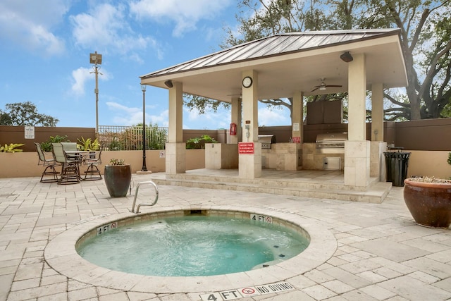 3525 Sage Rd Unit 813, Houston, TX 77056 - view of swimming pool with a community hot tub, a gazebo, a fenced backyard, and an outdoor kitchen