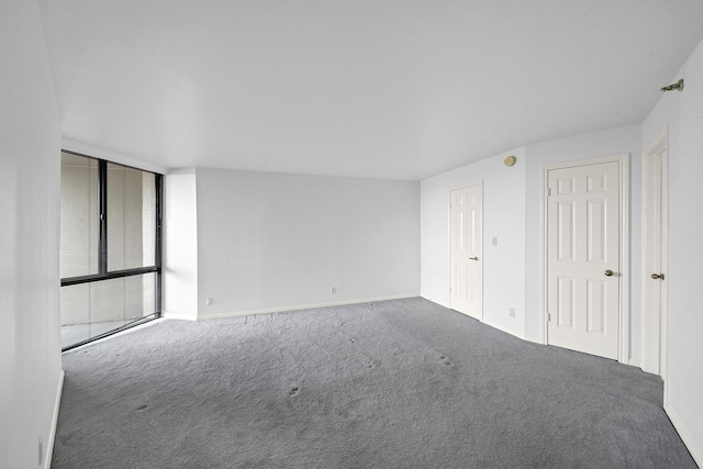 3525 Sage Rd Unit 813, Houston, TX 77056 - unfurnished bedroom with carpet and expansive windows