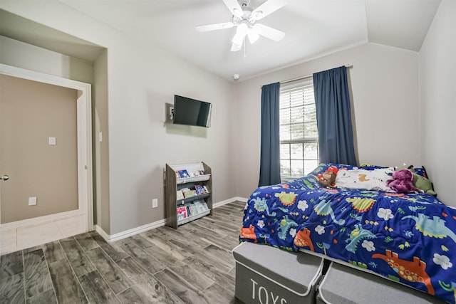 30806 Meadow Wood Dr, Fulshear, TX 77441 - bedroom with wood finished floors, lofted ceiling, and ceiling fan