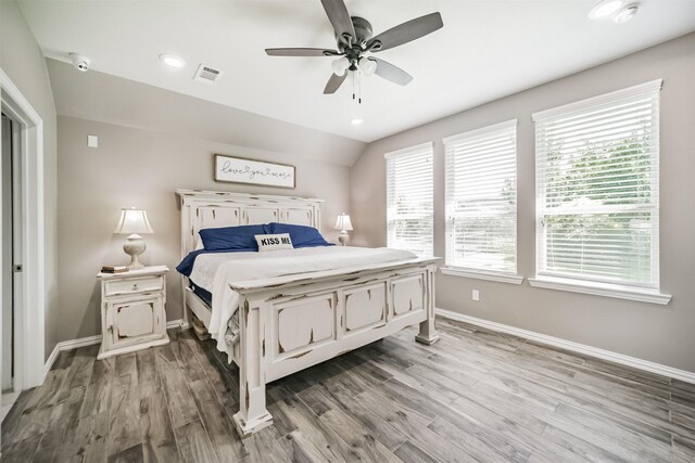 30806 Meadow Wood Dr, Fulshear, TX 77441 - bedroom featuring wood finished floors, ceiling fan, lofted ceiling, and recessed lighting