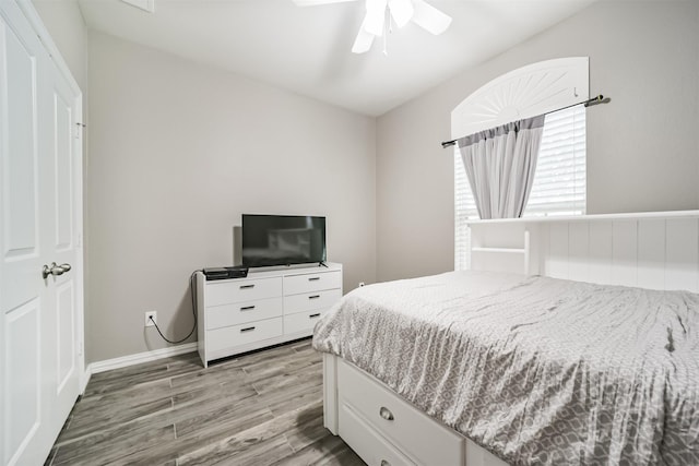 30806 Meadow Wood Dr, Fulshear, TX 77441 - bedroom with light wood finished floors and ceiling fan