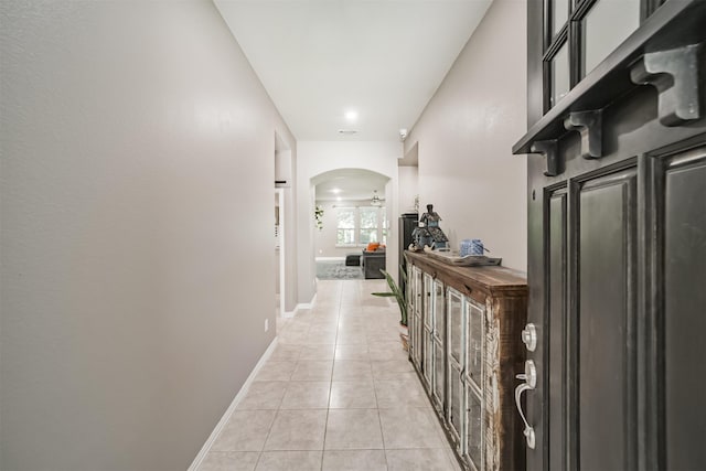 30806 Meadow Wood Dr, Fulshear, TX 77441 - corridor featuring arched walkways and light tile patterned flooring