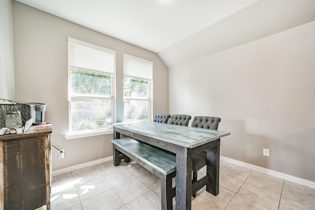30806 Meadow Wood Dr, Fulshear, TX 77441 - dining space with light tile patterned floors and lofted ceiling