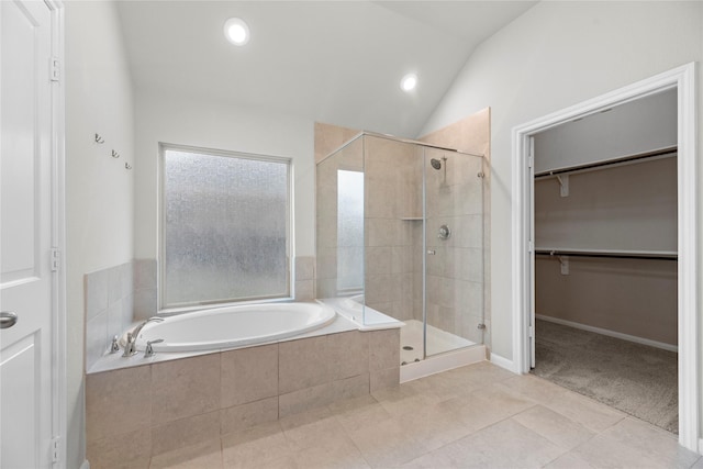 31222 S Pinebrook Falls Ln S, Hockley, TX 77447 - bathroom with a garden tub, a stall shower, tile patterned flooring, a walk in closet, and lofted ceiling