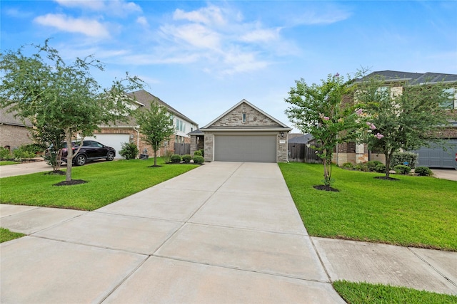31222 S Pinebrook Falls Ln S, Hockley, TX 77447 - view of front of property with concrete driveway, stone siding, and a garage