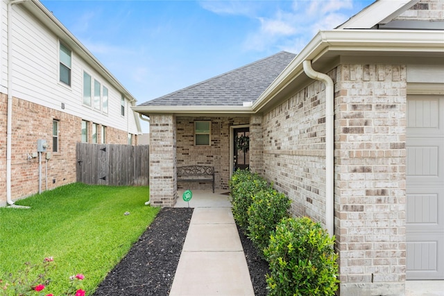 31222 S Pinebrook Falls Ln S, Hockley, TX 77447 - doorway to property with a shingled roof, brick siding, and a garage
