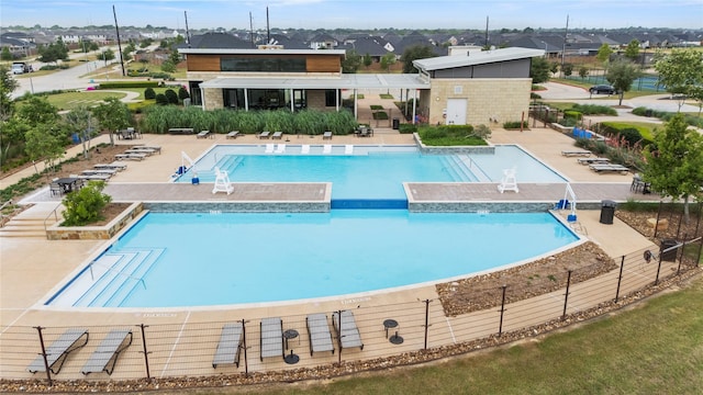 31222 S Pinebrook Falls Ln S, Hockley, TX 77447 - community pool featuring a patio area and a residential view