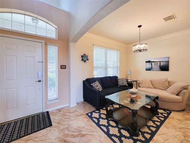 11811 Champions Grove Ln, Houston, TX 77066 - foyer entrance featuring light marble finish floors, arched walkways, healthy amount of natural light, crown molding, and a chandelier