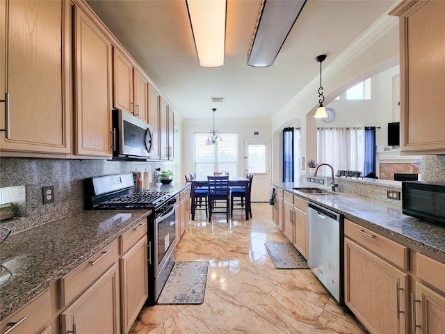 11811 Champions Grove Ln, Houston, TX 77066 - kitchen featuring stainless steel appliances, crown molding, decorative backsplash, light marble finish flooring, and decorative light fixtures